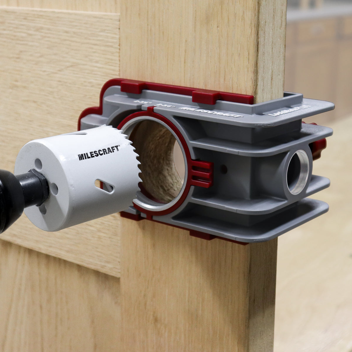 Milescraft LockMatePLUS self-clamping jig in use on a door for quick and accurate lock & knob installation