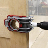 Milescraft LockMatePLUS Self-Clamping Lock & Knob Installation Jig in use on a wooden door