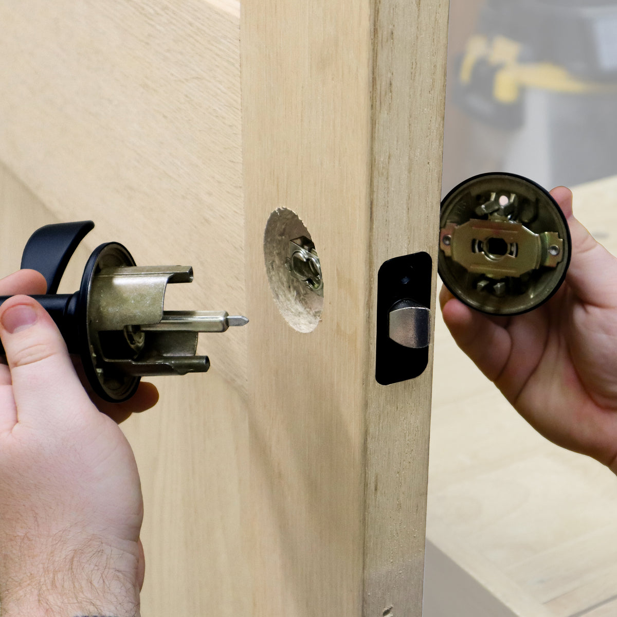 Milescraft LockMatePLUS Self-Clamping Lock & Knob Installation Jig in use on a door