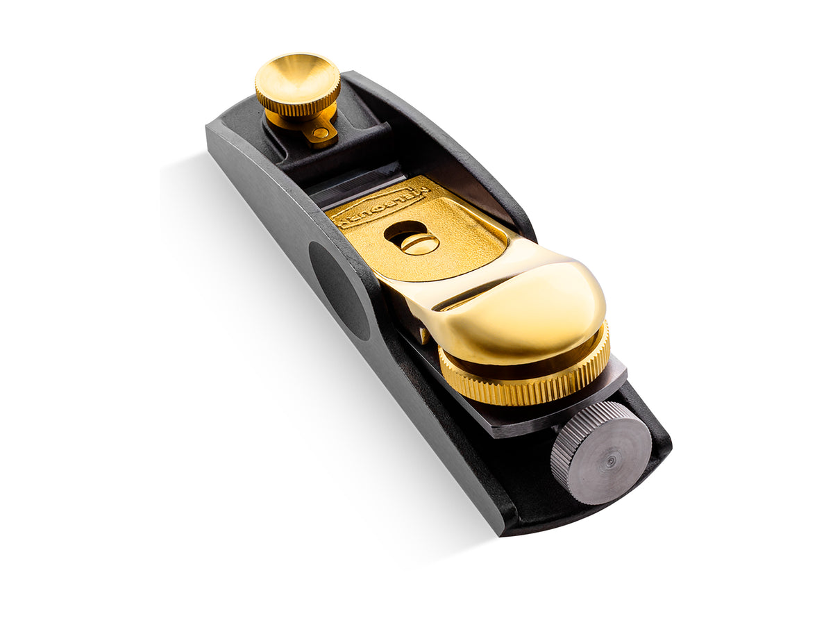Melbourne Tool Co. Low Angle Block Plane in use, showcasing precise wood shaving