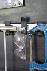 Superhooks Starter Bundle 15-Pieces Black Modular Tool Wall Hooks in use on a wall with tools hanging