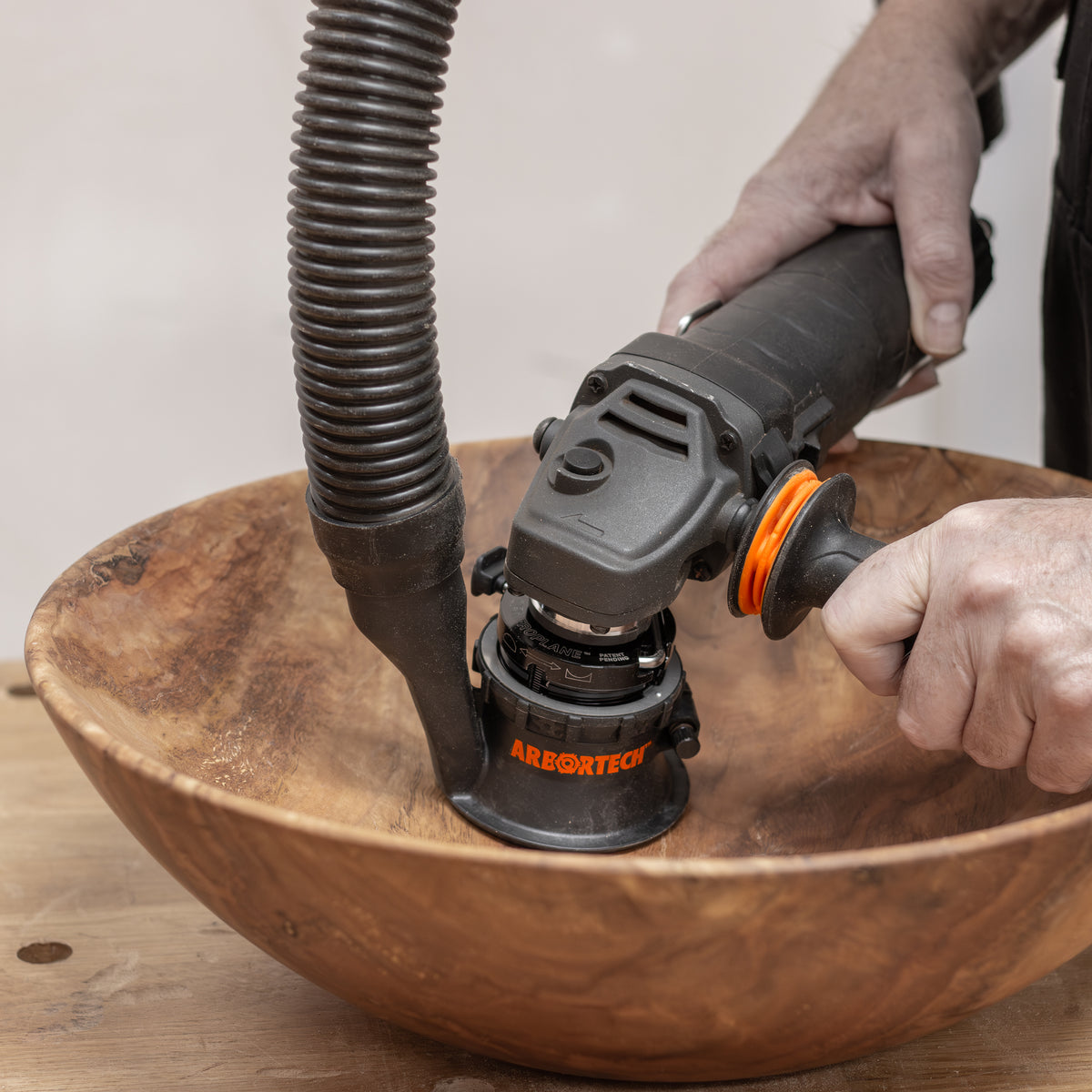 Arbortech SpheroPlane angle grinder attachment carving wooden sphere with adjustable radius for convex & concave projects