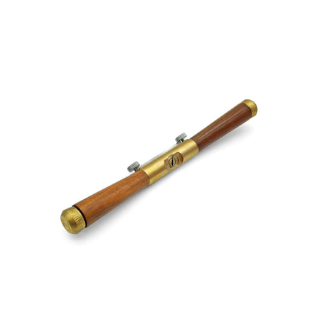 Wooden and brass spokeshave on a white background