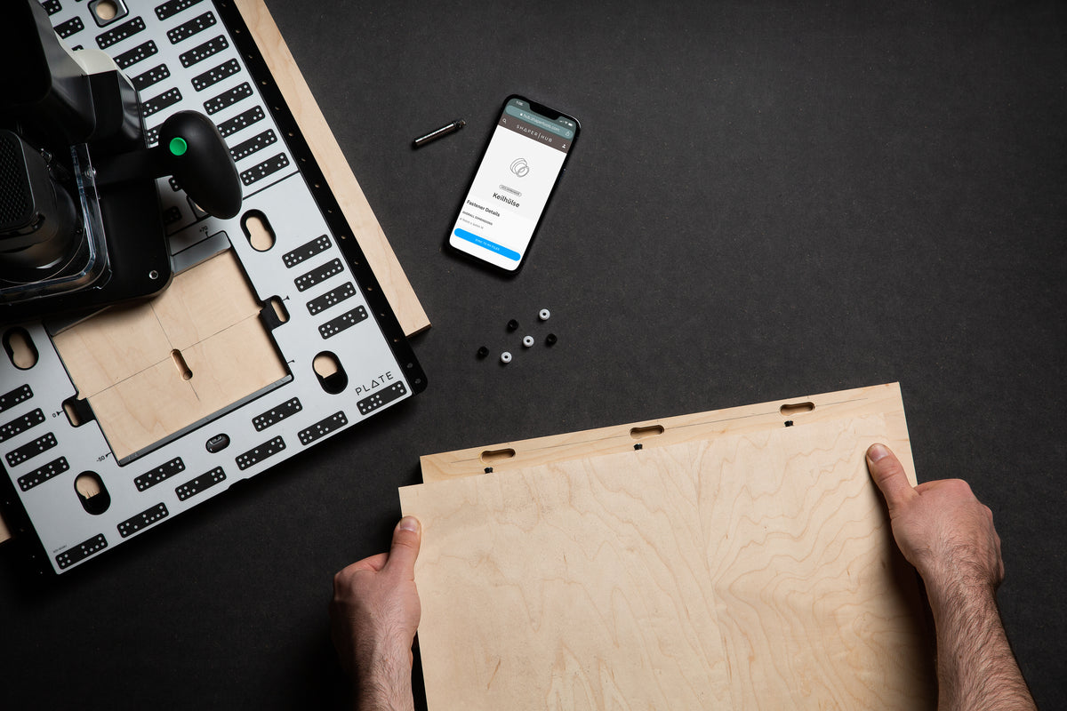 Shaper Plate Lifestyle Image demonstrating handheld CNC router and plate bundle in use