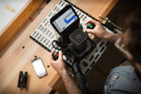 Shaper Plate universal template in use with Shaper Origin Handheld CNC Router at a woodworking site