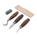 Three high-carbon carving knives in canvas roll with leather strop and sharpening compound