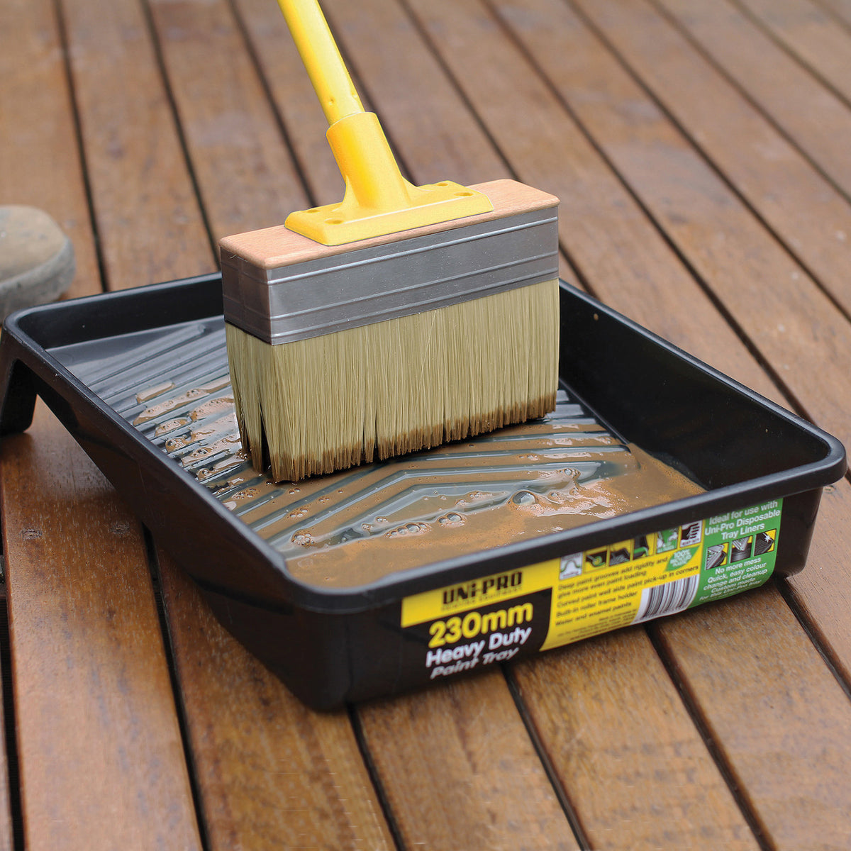 UniPro Jumbo Decking Brush applying stain between boards, 175mm width