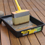 UniPro Jumbo Decking Brush applying stain between boards, 175mm width