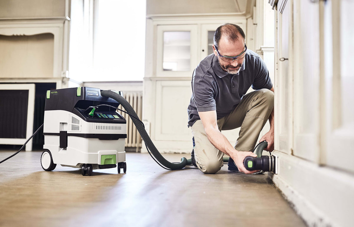 Festool CTM MIDI-I 15L M Class Dust Extractor in use with woodworking tools