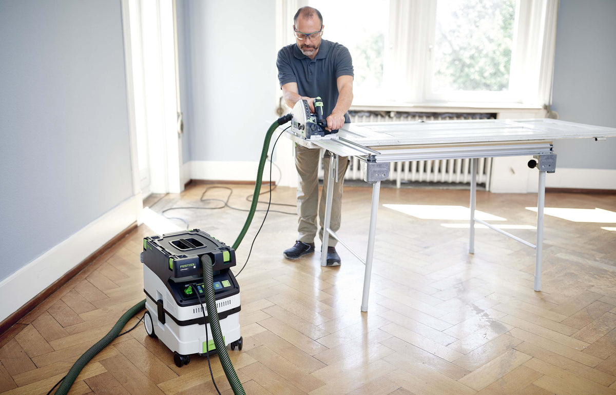 Festool CTM MIDI-I 15L M Class Dust Extractor in use with smooth suction hose and tool storage area