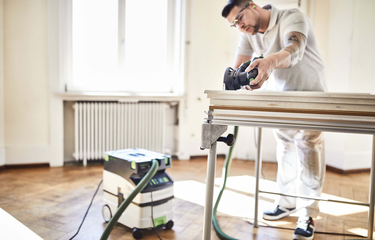 Compact Festool CTM MIDI-I 15L M Class Dust Extractor in action, suitable for woodworking tasks