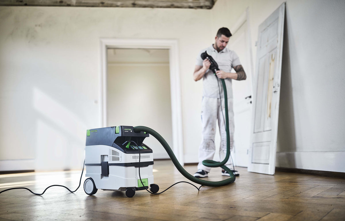 Compact Festool CTM MIDI M Class Dust Extractor in action, extracting dust efficiently
