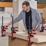 Bessey EZ360 One-Handed Clamp in action, showing innovative 360° rotating handle grip