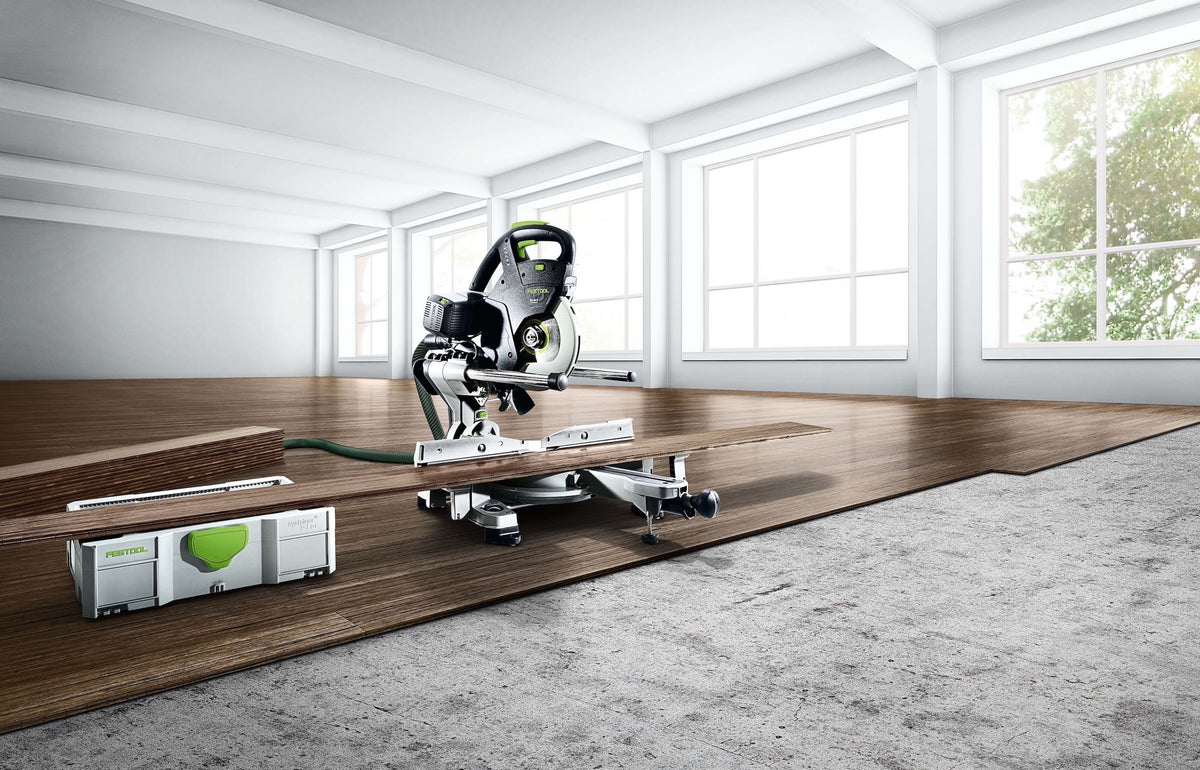 Festool KS 60 KAPEX Set 216mm Slide Compound Mitre Saw in use with LED spotlight at work site