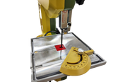 PROXXON MBS-240/E 6.5in Micro Bandsaw cutting wood at an angle